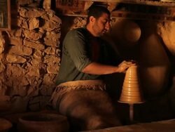 Tunisian Potter makes traditional pottery Stock Footage