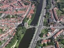 MS AERIAL View of Former city with wall Gatehouse at canal / Flanders, Belgium Stock Footage