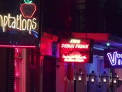 Nightlife neon signs on Bourbon Street in New Orleans Stock Footage