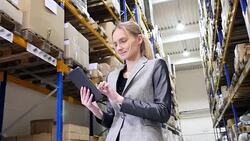 Responsible manager working on tablet in warehouse Stock Footage