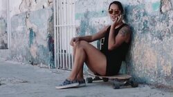 Urban skate girl with smart phone in street Stock Footage