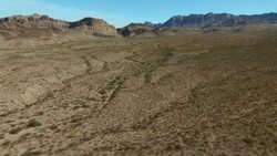 Panning over an expansive Big Bend landscape, with Burro Mesa and the Chisos Mountains on the horizon. Stock Footage