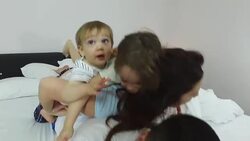 Family in bed Stock Footage