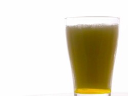 Pouring beer into rotate glass on white background Stock Footage