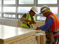Construction Workers Assemble Doors Stock Footage