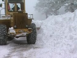 Large Yellow Snow Plow in action Stock Footage