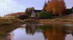 Static shot of a country home by a river Stock Footage