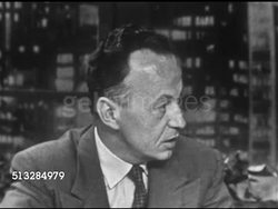 1952: PROGRAM EXPOSITION: Anchor Frank Blair sitting behind desk w/ Dr. Walter Regal, SOT asking if all can be explained, Dr. Regal saying No, convincd that visitors from space, comparing shape V-1 rocket, A-4 cigar shape, or A-9 swept back wings. Instructional Video