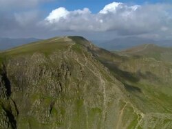 Aerial view over Striding Edge towards summit of  Helvellyn in the Lake District / Cumbria, England Stock Footage