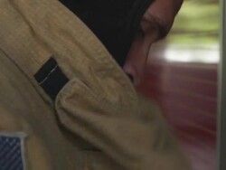 Handheld shot of a fireman getting ready to go out on an emergency call Stock Footage