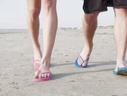  CU TS SLO MO Young couple walking on beach / Isle of Palms, South Carolina, USA Stock Footage
