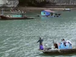 WS View of man and woman fishing on boat / Halong Bay, Vietnam  Stock Footage