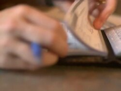 Women looking at a bill Stock Footage