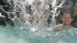 Family splashing in swimming pool Stock Footage