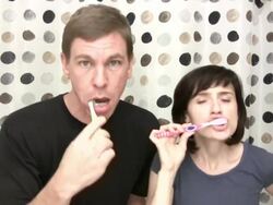 Couple brush teeth before bed Stock Footage