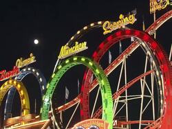 rollercoaster "Olympialooping" at night Stock Footage