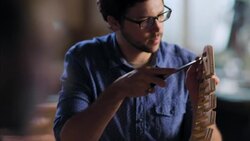 Expert young craftsman chisels wood in workshop Stock Footage