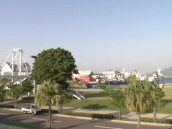 Pan across Kagoshima port with Sakurajima volcano in distance, Japan Stock Footage