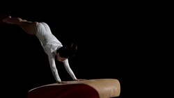 SLO MO Female gymnast doing front handspring on vault Stock Footage