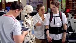 Physical therapist explaining spinal injury to man Stock Footage