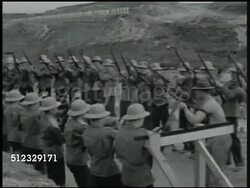 1942: U.S. MARINE CORPS RIFLE RANGE: LA MS Sign. XWS Soldiers lined up on range. WS Cadets being instructed on handling rifle. MS Instructor showing strap. WS Instructors adjusting soldiers laying w/ rifles. MS Cadets on floor w/ rifle, reloading. Instructional Video