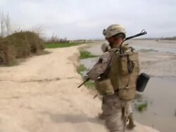 WS PAN Group of soldiers walking in landscape / Musa Qala, Helmand Province, Afghanistan. Stock Footage
