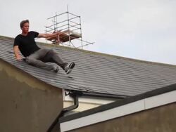 A young man doing a parkour freerunning jumping stunt. - Model Released - 1920x1080 - HD Stock Footage