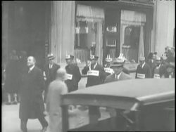 Men wear labels to advertise their skills hoping to work for one dollar per week. News Clip