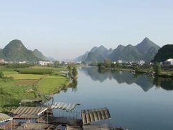 WS View of Karst Mountains and river / Close to Li River, Guangxi, China Stock Footage