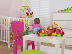 HD CRANE: Adorable Baby Girl Exploring Toys Stock Footage