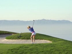 A woman playing golf. - Super Slow Motion - filmed at 240 fps Stock Footage