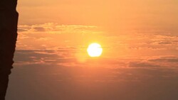 Sunrise through flowing cloud waves, mountain Stock Footage