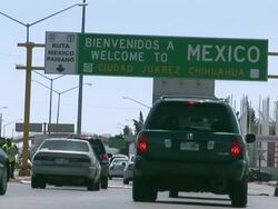 April 9 2009 WS LA Cars crossing Mexican and US border, entering Mexico, Juarez, Chihuahua, Mexico, AUDIO Stock Footage