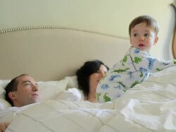 Family having lie in in bed Stock Footage