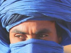 Male in traditional blue Touareg Headress, Sahara Morocco Africa Stock Footage