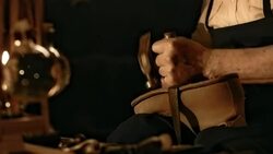 HD DOLLY: Traditional Shoemaker Fastening The Outsole Stock Footage