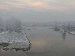 Po River flows under winter sky, frost crystals Stock Footage