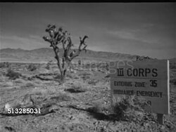 1952: NYE COUNTY, NEVADA: WS Joshua tree in desert w/ mountains BG. Angled WS Joshua tree w/ US Army sign 'III Corps Entering Zone 35 Ordnance Emergency' Cold War, testing, military exercises, Korean Conflict (War), preparation, restricted area. Instructional Video