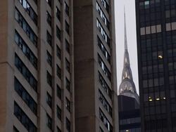 Chrysler Building stacked between apartment buildings at dusk. Stock Footage