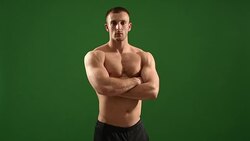 healthy athlete  with nice muscle on green  background Stock Footage