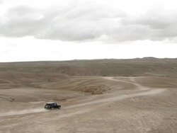 WS PAN View of car running on desert road / Marrakesh, Morocco Stock Footage
