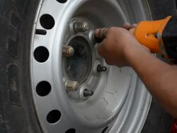 Screwing in Car Wheel Stock Footage