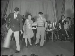 Couples dance the Charleston in a contest. News Clip