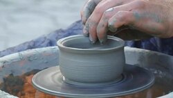 man creates pottery on a potter's wheel Stock Footage