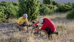 Two drone operators preparing the drone on the hilltop Stock Footage