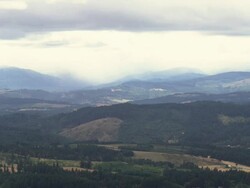 WS View of Rain falls on country hillside of Oregon and Farms, vineyards and trees populate / Cornelius, Oregon, United States  Stock Footage