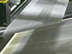 CU Shot of news paper being print in web press at newspaper printing office / Russelheim, Hesse, Germany Stock Footage