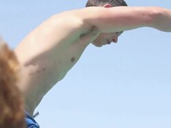 Close-up of a young man jumping off a boat and doing a flip in Malta. - Model Released - 1920x1080 - HD Stock Footage