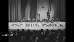 1946: ATOMIC SYMPOSIUM: HD: HA WS (Audience POV) Stage w/ men seated behind sign 'Atomic Energy Symposium', audience seated FG. SOT Conant (C) saying nuclear power not to replace electrical in U.S., L.R. Groves saying until we know more than we do now... Instructional Video