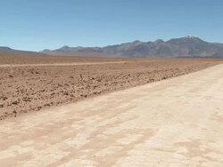 WS PAN View of empty road through desert in high Andes / San Pedro de Atacama, Norte Grande, Chile Stock Footage